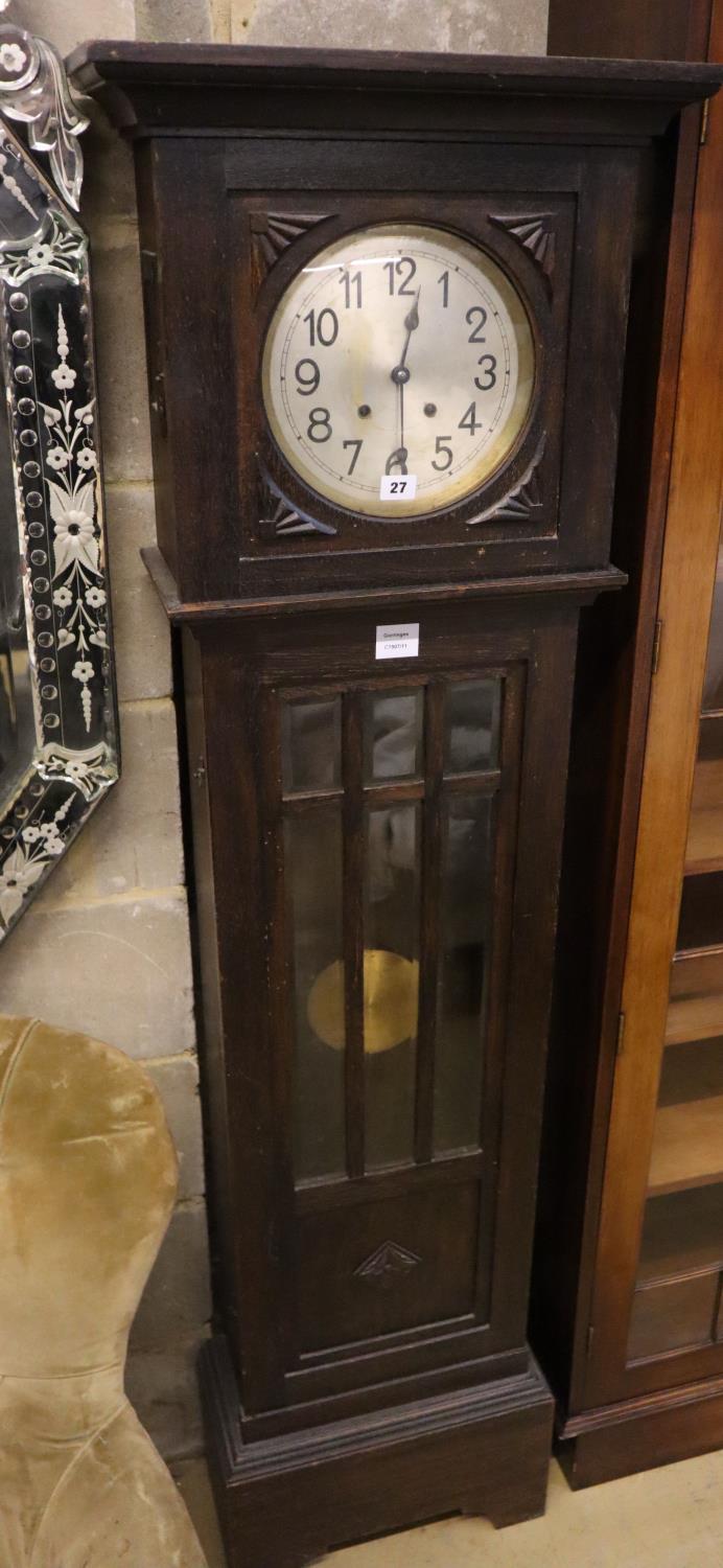 A 1930's oak cased eight day striking longcase clock, 173cm high