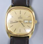 A gentleman's steel and gold plated Omega quartz day date wrist watch, on associated leather strap.