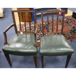 A set of six Hepplewhite style mahogany chairs (two with arms)