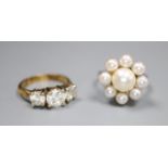 A modern 18ct white gold and cultured pearl cluster ring, size L/M, gross 7 grams and a paste set