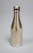 An Edwardian novelty silver pepperette, modelled as a Champagne bottle, Saunders & Shepherd,