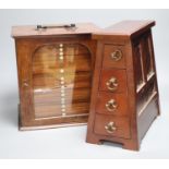 A Victorian mahogany coin collector's cabinet, 27cm wide, and a mahogany table top bank of four