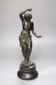 A 19th century bronze figure of a dancing bacchanal, indistinctly signed, 42cm high overall