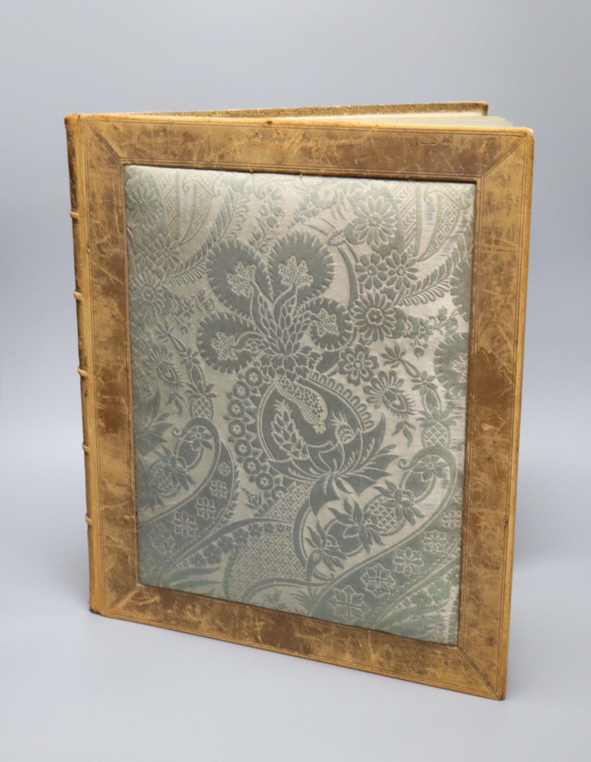 A Victorian leather bound album of mezzotint portraits with fine watercolour embellishments, 44 x