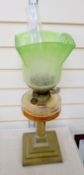 An Edwardian brass and glass oil lamp