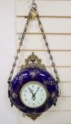 A late 19th century French wall clock, with floral-decorated blue ceramic frame, circular