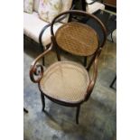 An early 20th century caned bentwood elbow chair