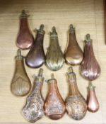 A group of ten Victorian copper / brass powder flasks