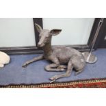 A bronze recumbent deer garden ornament, height 54cm