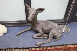 A bronze recumbent deer garden ornament, height 54cm