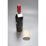 A bottle of Chateau Latour 1980, label detached