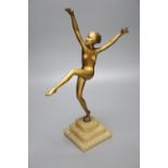 An Art Nouveau bronzed spelter nude dancer, on stepped square alabaster base, 38.5cm