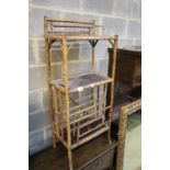 A late Victorian lacquered three tier bamboo Canterbury whatnot, width 50cm, depth 31cm, height