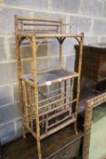 A late Victorian lacquered three tier bamboo Canterbury whatnot, width 50cm, depth 31cm, height