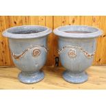 A pair of blue glazed terracotta pots, with swag design, height 51cm