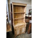 A Victorian style narrow pine dresser, width 76cm, depth 33cm, height 187cm