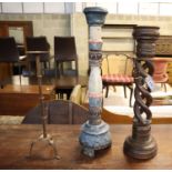 Two carved wooden candlesticks and an iron pricket candlestick (3), largest 87cm high