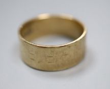 A 9ct gold band (worn), size M, 4.3 grams.