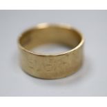 A 9ct gold band (worn), size M, 4.3 grams.