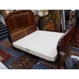 An early 20th century French marquetry inlaid gilt metal mounted bed frame, width 167cm