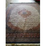 A large Persian carpet, 400 x 300cm