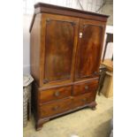 A Regency mahogany linen press, width 124cm, depth 60cm, height 192cm (top cut to fit eaves)