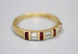 A modern 18ct gold, square cut ruby and baguette cut diamond set half hoop ring, size Q, gross 3.6