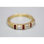 A modern 18ct gold, square cut ruby and baguette cut diamond set half hoop ring, size Q, gross 3.6