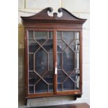 A George III style mahogany two door hanging glazed cabinet, width 70cm, depth 22cm, height 115cm