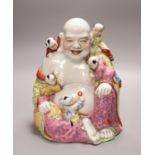 A Chinese famille rose figure of Budai, mid 20th century, 26cm