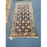 A North West Persian blue ground rug, 190 x 90cm
