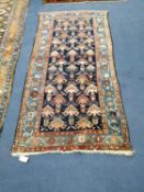 A North West Persian blue ground rug, 190 x 90cm