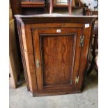 A George III oak hanging corner cabinet, width 74cm, depth 42cm, height 92cm