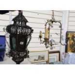 An Italian wrought iron and coloured glass hanging lantern and a brass chandelier, mounted with