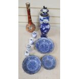 A graduated set of three Chinese porcelain blue and white bowls, largest 19cm and a group of four
