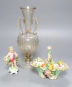 A Coalbrookdale floral encrusted basket, a Bow porcelain putto and a Venetian two handled glass