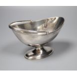 A Victorian oval silver swing-handled sugar basket, having thread edge, Sheffield, 1888, height 10.