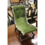 A Victorian ebonised slipper chair
