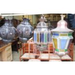 A Moroccan copper and stained glass octagonal hanging lantern and a pair of pierced bronzed metal