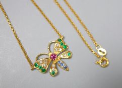 A modern 9ct gold, ruby, emerald, sapphire and diamond set butterfly pendant necklace, 45cm, gross
