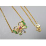 A modern 9ct gold, ruby, emerald, sapphire and diamond set butterfly pendant necklace, 45cm, gross