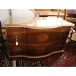 An inlaid walnut chest of shaped form, fitted two long drawers on plinth base, width 124cm, depth