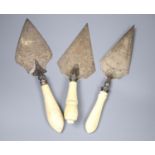 Two Victorian ivory handled silver presentation trowels, one a.f. and a similar plated trowel.