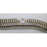 An early to mid 20th century white metal fancy fringe necklace, 40cm, 33.8 grams.CONDITION: