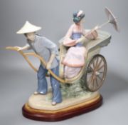 A large Lladro of a Japanese rickshaw, on plinth, height 33cm