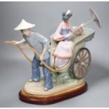 A large Lladro of a Japanese rickshaw, on plinth, height 33cm