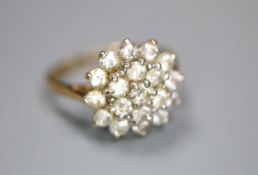 A modern 9ct gold and cubic zirconia cluster set dress ring, size J, gross 2.3 grams.