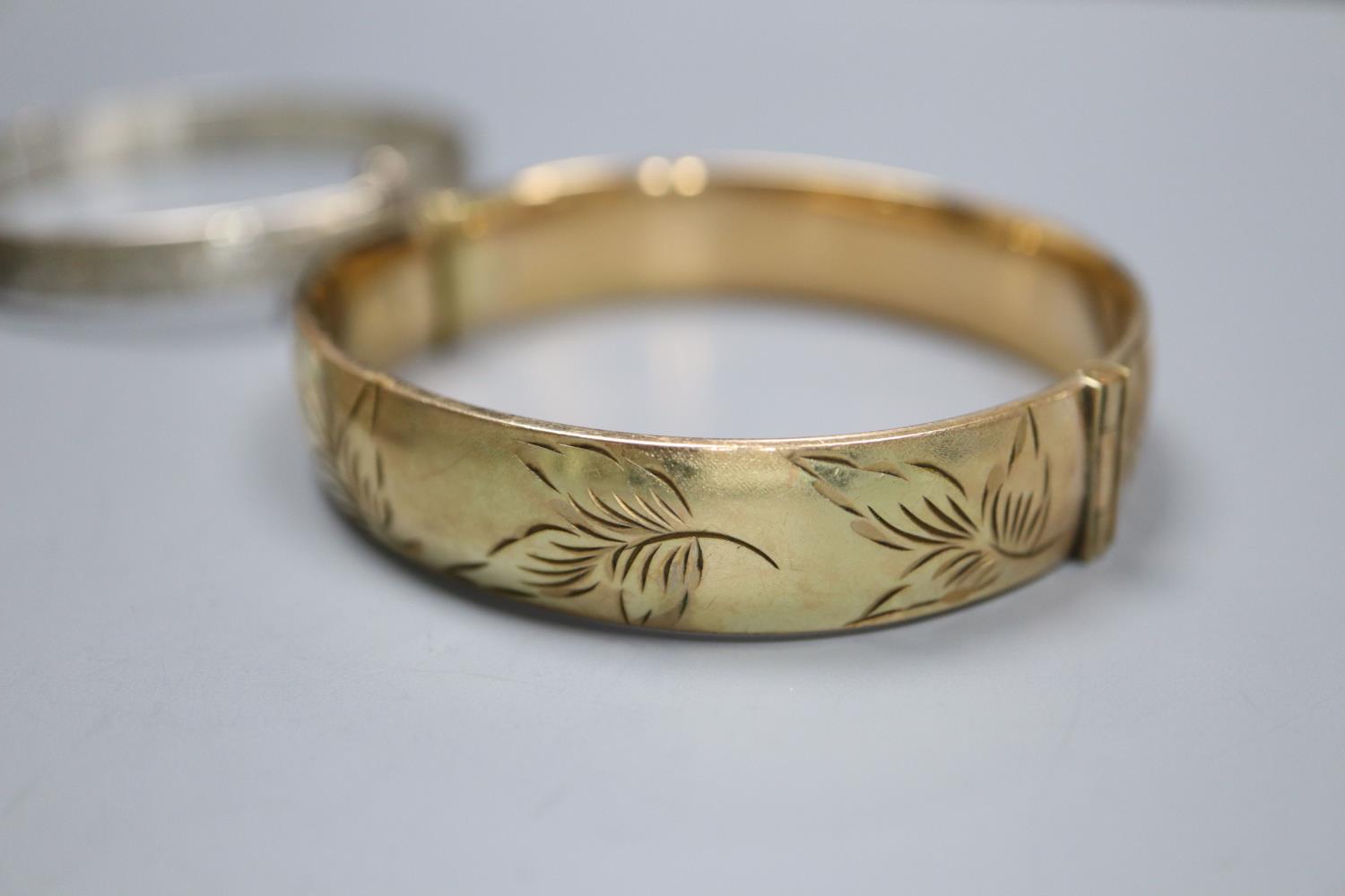 Four assorted silver bangles and a gold plated bangle. - Image 2 of 5