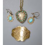 A modern pierced 9ct gold and turquoise set heart shaped locket, on a 9ct chain, gross 8.5 grams,