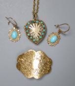 A modern pierced 9ct gold and turquoise set heart shaped locket, on a 9ct chain, gross 8.5 grams,